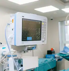 Hospital room with heart monitor and medical equipment, highlighting RMF’s expertise in electronic design for medical and diagnostic applications.